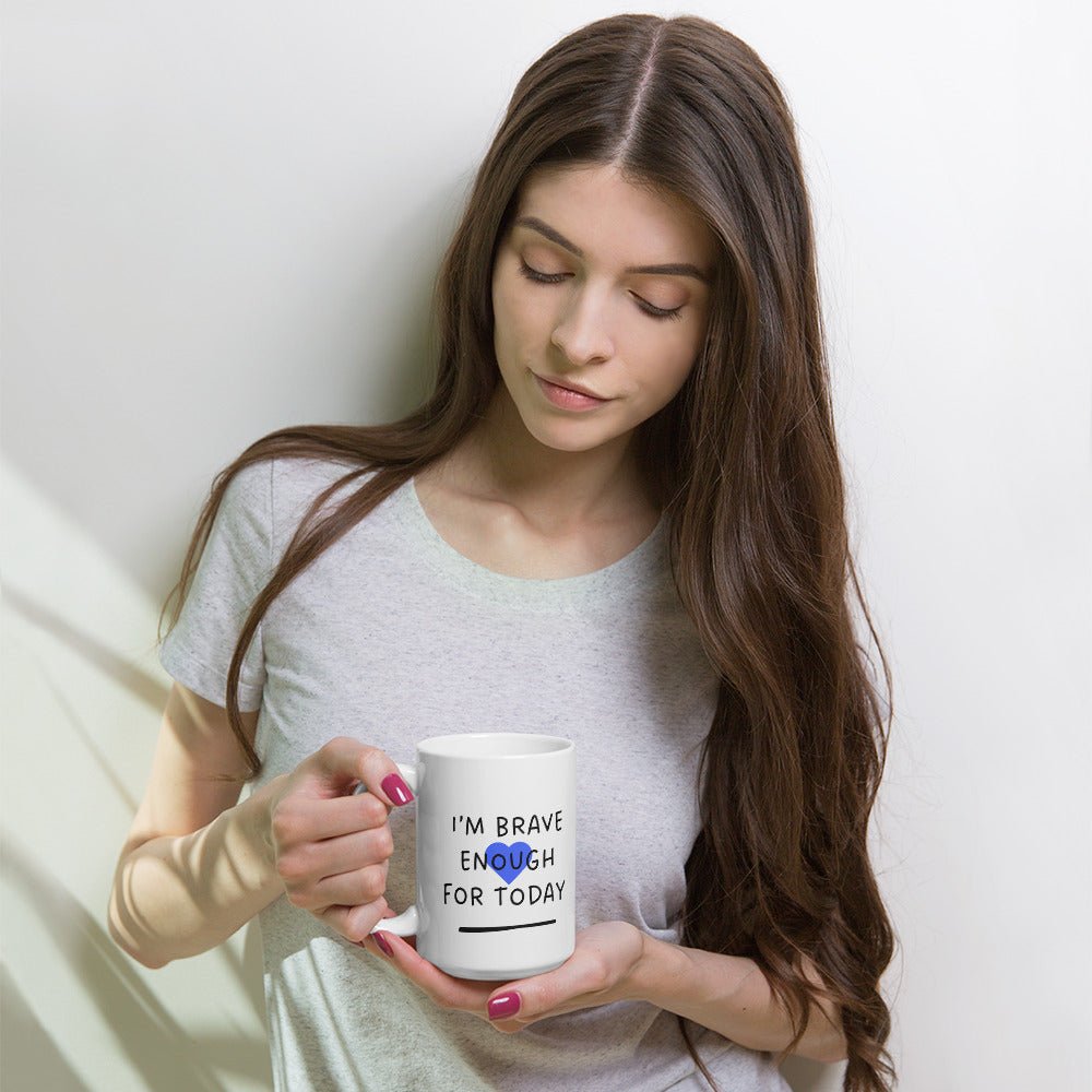 Woman holding a mug with text against a white background