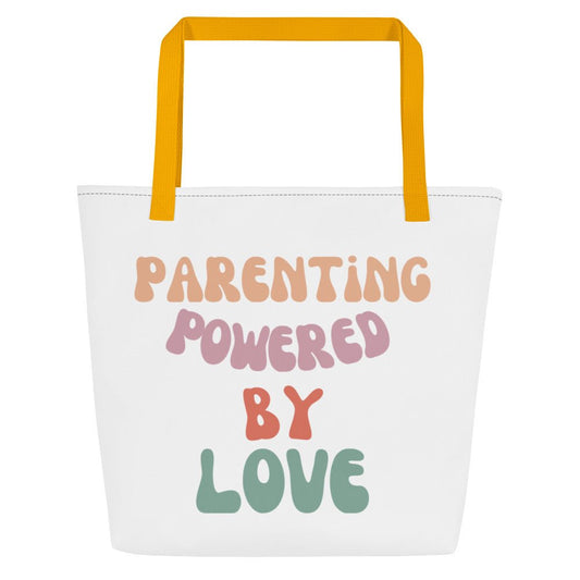 White tote bag with 'Parenting Powered by Love' text and yellow handles on a white background