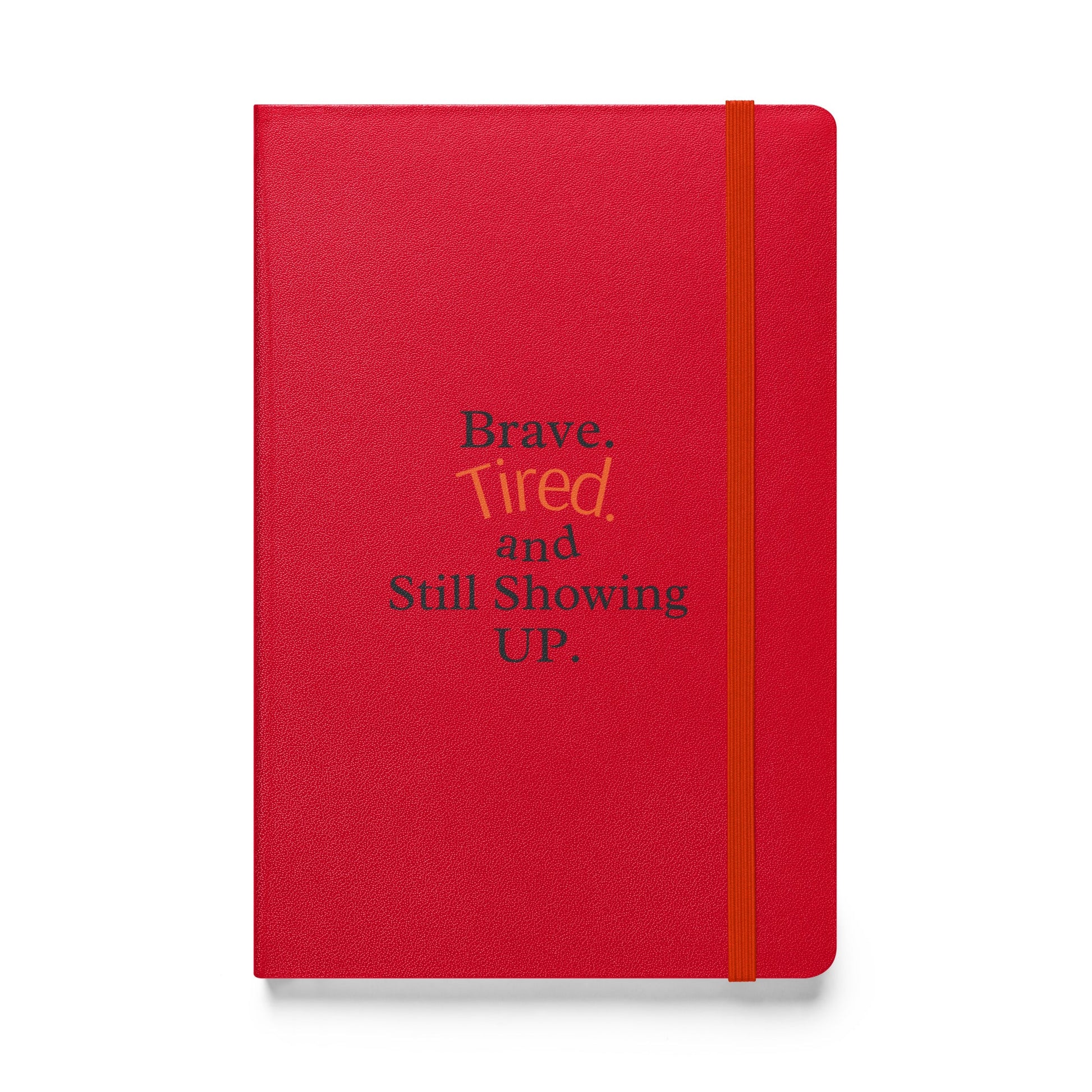 Red notebook with motivational text on a white background