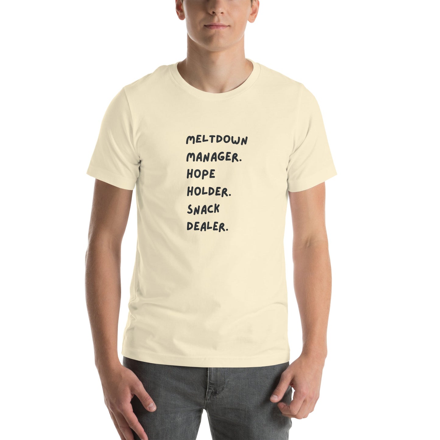 Person wearing a beige t-shirt with text on a white background