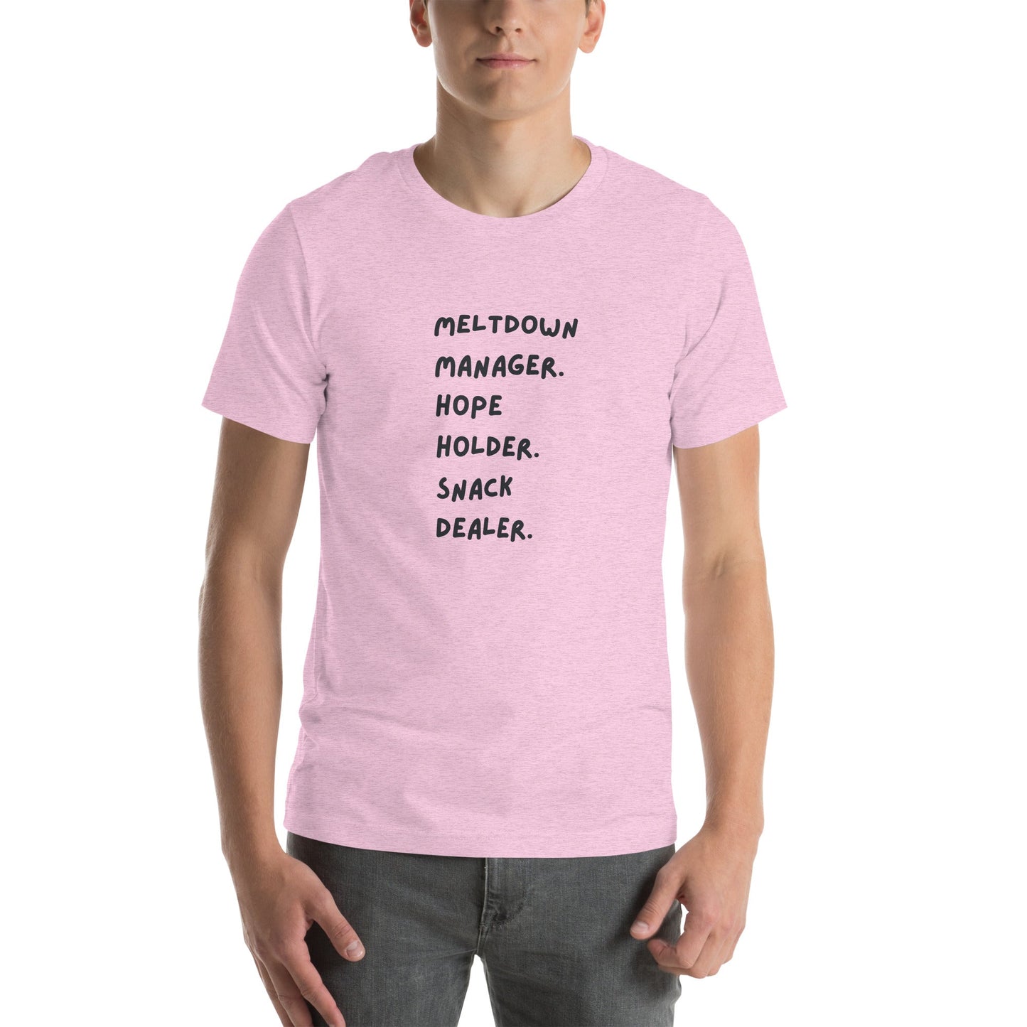 Person wearing a pink t-shirt with text on a white background