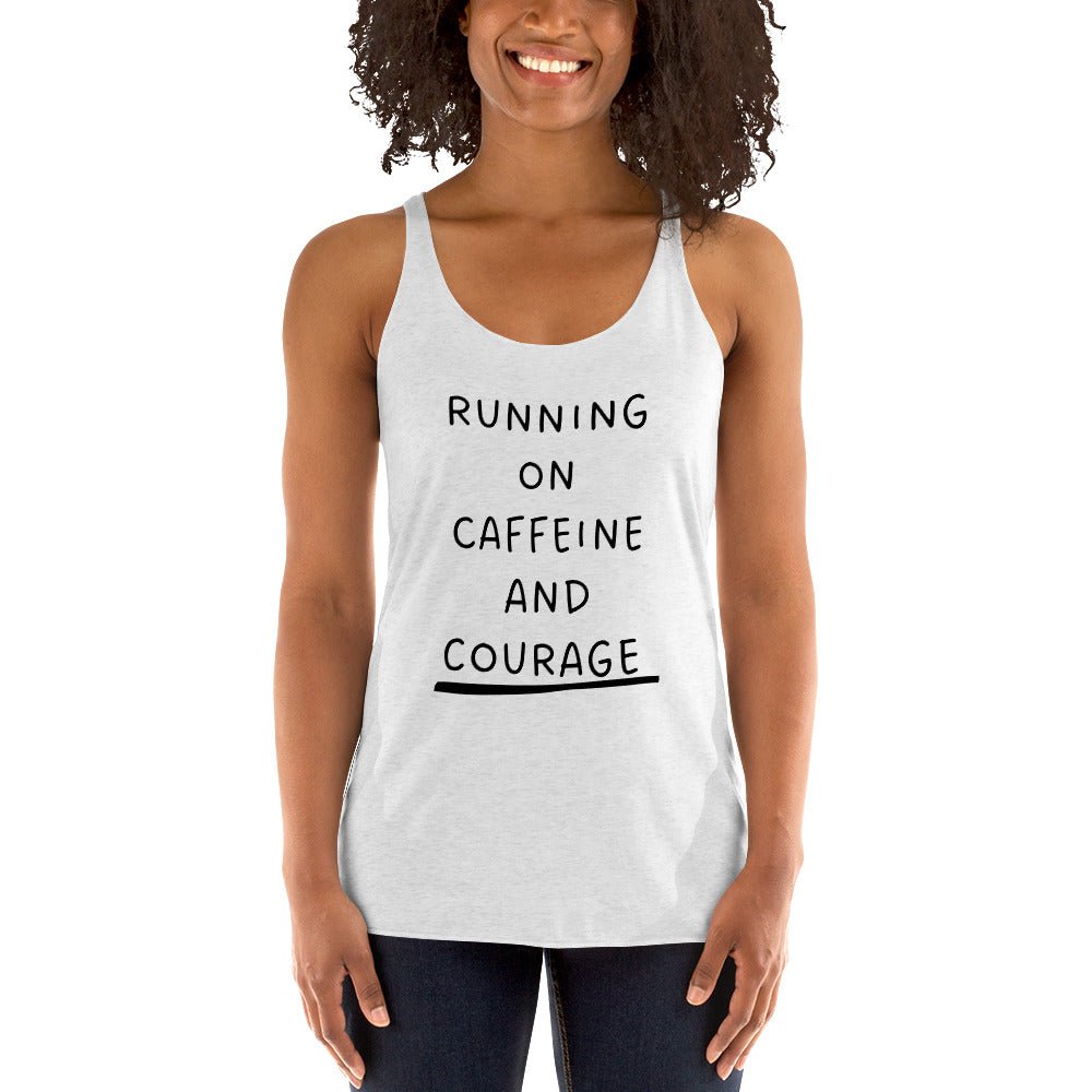Woman wearing a white tank top with 'RUNNING ON CAFFEINE AND COURAGE' text.
